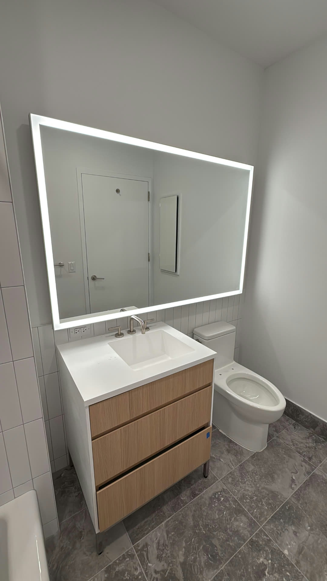 Custom backlit LED vanity mirror installation