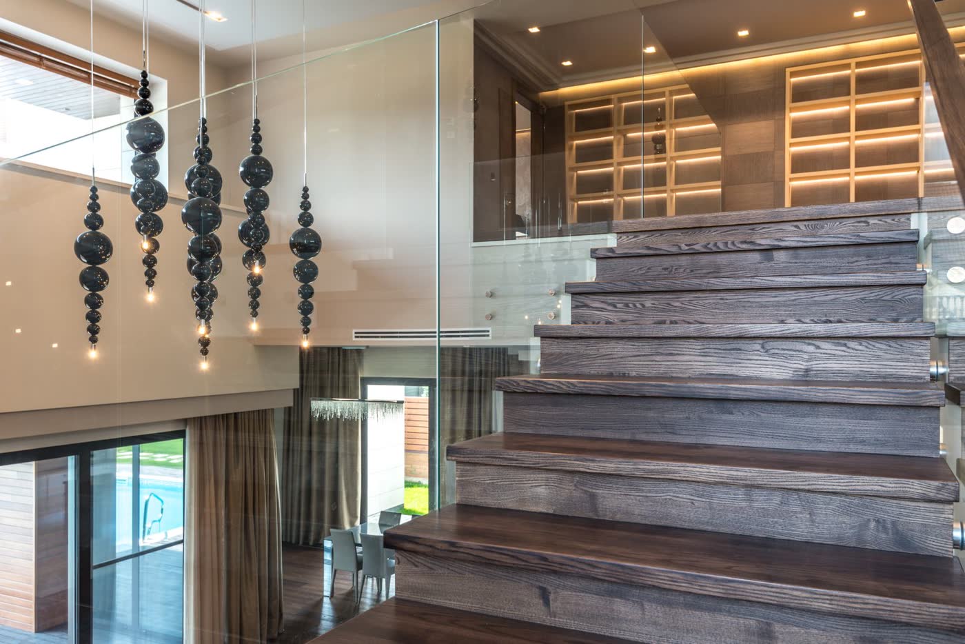 Modern wood staircase with glass railing